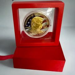 Red Box with Trump Commemorative Coin, new, unopened.
