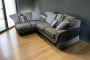 Grey corner sofa with matching scatter cushions