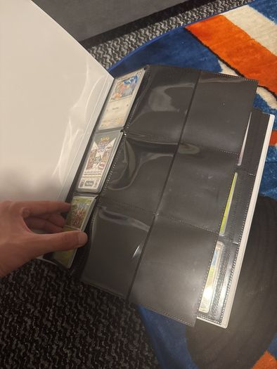 pokemon cards and book and sleeves and game thing