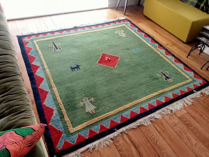 hand-knotted green Gabbeh rug