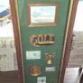 Beautiful Wooden Golf-Themed Shadow Box and Storage Unit with Shelves Cabinet, featuring a glass door front Inside the glass display panel, it showcases a vintage-style collage celebrating the history of golf, Image 2