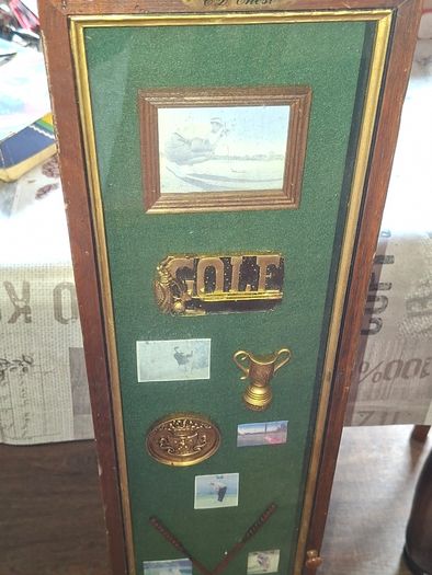 Beautiful Wooden Golf-Themed Shadow Box and Storage Unit with Shelves Cabinet, featuring a glass door front Inside the glass display panel, it showcases a vintage-style collage celebrating the history of golf,
