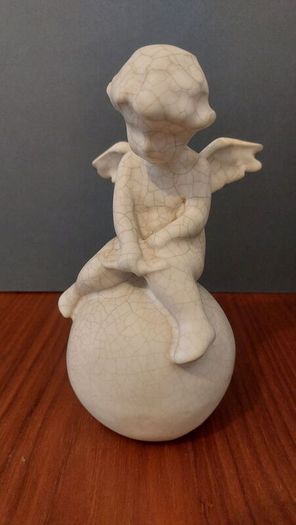 Lovely Vintage Pair of Ceramic Baby Winged Angels Sitting on Globes with a Very Tactile Cream Coloured Crackle Glaze