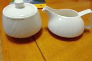 Elegant milk jug and lidded sugar dish