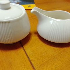 Elegant milk jug and lidded sugar dish