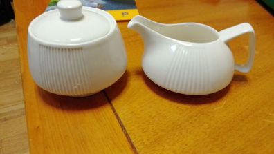 Elegant milk jug and lidded sugar dish