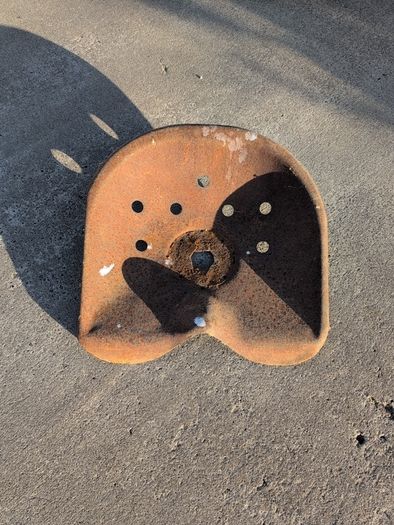 Old farming implement seat. Suitable for garden.