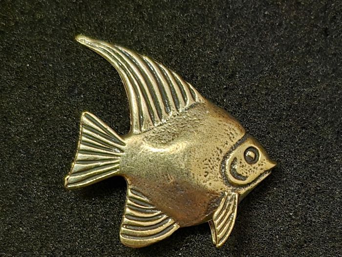 3 brass fish.