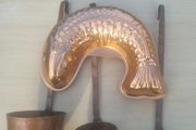 Vintage-style copper cookware and kitchen accessories.
