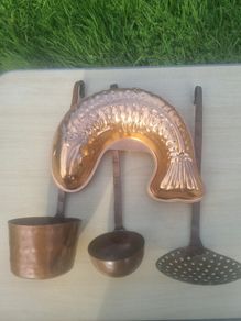 Vintage-style copper cookware and kitchen accessories.