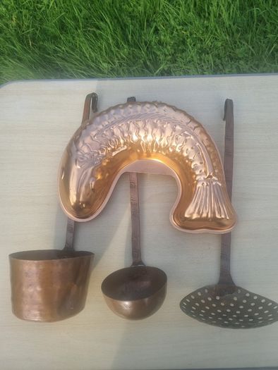Vintage-style copper cookware and kitchen accessories.