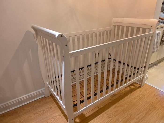 sleigh-style  baby crib and changing table