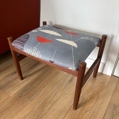 Mid Century Style Wooden Footstool / Ottoman with retro atomic-inspired upholstered seat.