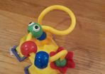 Toy to attach to a buggy bar