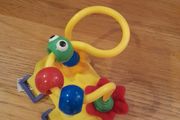Toy to attach to a buggy bar