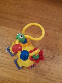Toy to attach to a buggy bar
