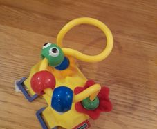 Toy to attach to a buggy bar