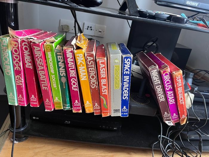 Atari 2600 Space Invaders Woody Atari 2600 with 15 individual games and 14 game Indy 500 driving