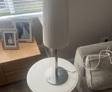 IKEA 365+ LUNTA table lamp, model B0725, tall pleated fabric shade.  It is a discontinued/vintage design, and there is s. One Irish lifestyle source recorded the LUNTA table lamp