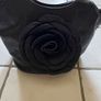 Handbag dressy occasional crossbody bag. Black Medium Size hand bag With Large Flora Feature . Detachable strap. Excellent Condition. Bought In Toulouse. Image 2