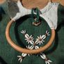 handmade boho style green burlap handbag featuring a circular wooden top handle and distinctive floral cowrie shell embellishments. Great condition Image 3