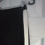 Black skinny trousers featuring contrast white side stripes, size 8 Image 4