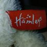 White hamleys teddy bear baby gift.  Soft white teddy with white bow. Image 2