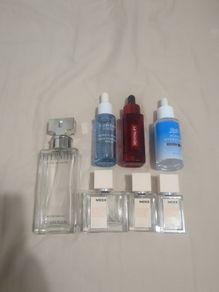 Empty perfume and face serum bottles