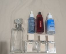 Empty perfume and face serum bottles