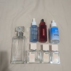 Empty perfume and face serum bottles