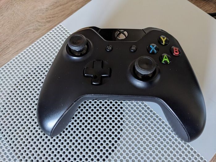 Xbox One S 1TB with controller and cables.