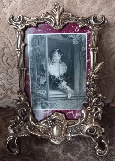 Pair of brass picture frames.