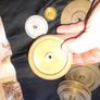 17 Old Pulley Wheels and 5 Plates, alot are brass Image 9