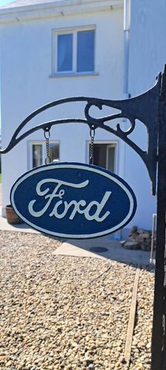 Ford hanging cast iron sign