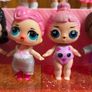 A lot of L.O.L. Surprise dolls with accessories and a doll podium. Image 5