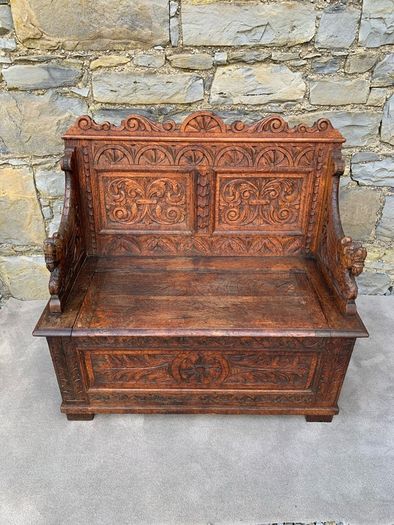 Late Victorian Gothic Revival Carved Oak Hall Settle.