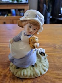 Vintage Porcelain figurine girl holding cat