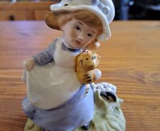 Vintage Porcelain figurine girl holding cat