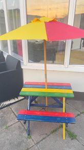 Picnic table with parasol