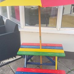 Picnic table with parasol