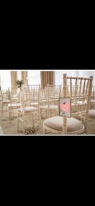 Twelve hanging photo frames for chairs / pews for wedding