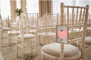 Twelve hanging photo frames for chairs / pews for wedding