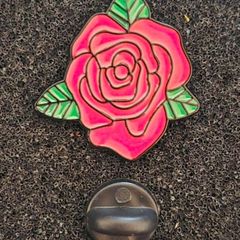 Rose ,  pin back badge.