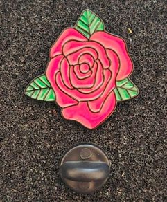 Rose ,  pin back badge.