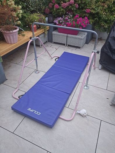 Kids gymnastics bar and folding mat