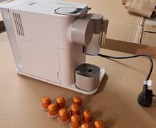 Nespresso coffee machine DeLonghi with milk frother.