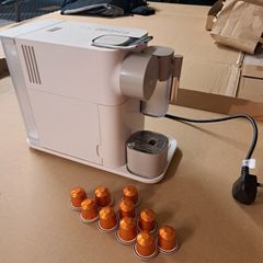 Nespresso coffee machine DeLonghi with milk frother.