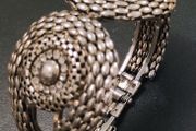 Silver tone textured hinged cuff bracelet