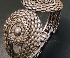 Silver tone textured hinged cuff bracelet