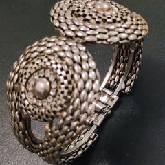Silver tone textured hinged cuff bracelet